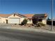 One-story house with solar panels and desert landscaping at 4636 Ferrell St, North Las Vegas, NV 89031