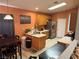 Eat-in kitchen with wood cabinets, stainless steel appliances, and tile flooring at 4636 Ferrell St, North Las Vegas, NV 89031