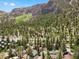 Aerial view of a mountain community with numerous homes nestled among trees at 4765 Silver Tip Trl, Mount Charleston, NV 89124