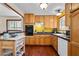 Well-equipped kitchen featuring wood cabinets and granite countertops at 4765 Silver Tip Trl, Mount Charleston, NV 89124