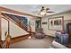 Living room with staircase, wood stove and hardwood floors at 4765 Silver Tip Trl, Mount Charleston, NV 89124