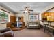 Living room with wood stove, seating, and view into kitchen at 4765 Silver Tip Trl, Mount Charleston, NV 89124