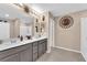 Modern bathroom with double vanity and large mirror at 4823 Kinworthy St, North Las Vegas, NV 89081