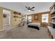 Large bedroom with a queen bed and built-in shelving at 4823 Kinworthy St, North Las Vegas, NV 89081