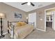 Bright bedroom with daybed, ceiling fan, and en-suite bathroom at 4823 Kinworthy St, North Las Vegas, NV 89081