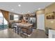 Kitchen with granite island, gray cabinets, and stainless steel appliances at 4823 Kinworthy St, North Las Vegas, NV 89081