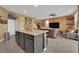 Spacious kitchen with a large island, granite countertops, and modern appliances at 4823 Kinworthy St, North Las Vegas, NV 89081