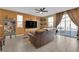 Living room with brown leather couches and access to the backyard at 4823 Kinworthy St, North Las Vegas, NV 89081