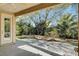 Covered patio overlooking a spacious backyard with mature trees at 5026 Vincitor St, Las Vegas, NV 89135