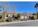 Single-story home with white garage door and desert landscaping at 5026 Vincitor St, Las Vegas, NV 89135