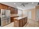 Spacious kitchen with island, stainless steel appliances, and ample cabinetry at 5026 Vincitor St, Las Vegas, NV 89135