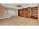 Living room with built-in shelving and access to front entry at 5026 Vincitor St, Las Vegas, NV 89135