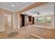 Living room with built-in shelving and access to the backyard at 5026 Vincitor St, Las Vegas, NV 89135