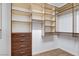 Large walk-in closet with custom shelving and drawers at 5026 Vincitor St, Las Vegas, NV 89135