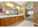 Main bathroom with double vanity, large shower and walk-in closet at 5550 Carrara Pointe St, Pahrump, NV 89061