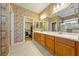 Main bathroom with double vanity and walk-in closet at 5550 Carrara Pointe St, Pahrump, NV 89061