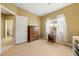 Well-lit bedroom with wood floors and built-in dresser at 5550 Carrara Pointe St, Pahrump, NV 89061