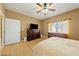 Bright bedroom with ceiling fan and wood dresser at 5550 Carrara Pointe St, Pahrump, NV 89061