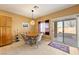 Bright dining area with wood cabinets and access to backyard at 5550 Carrara Pointe St, Pahrump, NV 89061