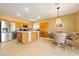 Open kitchen with island and wood cabinetry at 5550 Carrara Pointe St, Pahrump, NV 89061