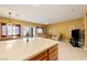 Open kitchen with island overlooking living room at 5550 Carrara Pointe St, Pahrump, NV 89061