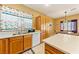 Kitchen features wood cabinets and a white sink at 5550 Carrara Pointe St, Pahrump, NV 89061