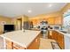 Kitchen features stainless steel appliances and an island at 5550 Carrara Pointe St, Pahrump, NV 89061