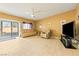 Living room features sliding glass doors to backyard and tile floors at 5550 Carrara Pointe St, Pahrump, NV 89061