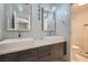 Modern bathroom with double sinks, large mirrors, and updated vanity at 5599 Valley Mill St, Las Vegas, NV 89148