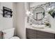 Stylish bathroom with modern vanity, mosaic tile, and updated fixtures at 5599 Valley Mill St, Las Vegas, NV 89148