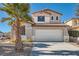 Two-story house with a two-car garage and palm tree at 5599 Valley Mill St, Las Vegas, NV 89148