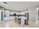 Spacious kitchen featuring white cabinets, an island, and stainless steel appliances at 5599 Valley Mill St, Las Vegas, NV 89148