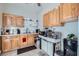 Cozy kitchen with wood cabinets and various appliances at 5599 Valley Mill St, Las Vegas, NV 89148