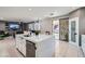 Modern kitchen with island, stainless steel appliances, and white cabinetry at 5599 Valley Mill St, Las Vegas, NV 89148