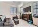 Cozy living room featuring a fireplace and large TV at 5599 Valley Mill St, Las Vegas, NV 89148