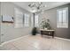 Sunlit office space with a console table and potted plants at 5599 Valley Mill St, Las Vegas, NV 89148