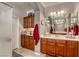 Bright bathroom featuring double sinks, a shower, and built-in cabinetry at 5741 Pleasant Palms St, North Las Vegas, NV 89081