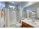 Clean bathroom with a shower/tub combo and wood vanity at 5741 Pleasant Palms St, North Las Vegas, NV 89081