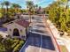 Gated community entrance with guardhouse and landscaping at 5741 Pleasant Palms St, North Las Vegas, NV 89081