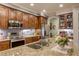 Modern kitchen featuring granite countertops and stainless steel appliances at 5741 Pleasant Palms St, North Las Vegas, NV 89081