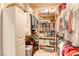 Well-organized walk-in closet with shelving and hanging rods at 5741 Pleasant Palms St, North Las Vegas, NV 89081