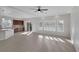 Bright and airy living room with tile flooring and access to kitchen at 5977 Ancient Peaks Ave, Las Vegas, NV 89141