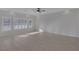 Sunlit living room featuring tile floors and ceiling fan at 5977 Ancient Peaks Ave, Las Vegas, NV 89141