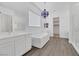 Elegant bathroom with soaking tub, double vanity, and modern fixtures at 6364 Cambridge Creek Ct, Las Vegas, NV 89149