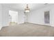 Main bedroom with plush carpeting and a chandelier at 6364 Cambridge Creek Ct, Las Vegas, NV 89149