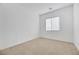 Simple bedroom with window and neutral carpet at 6364 Cambridge Creek Ct, Las Vegas, NV 89149