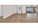 Bright dining room with hardwood floors and sliding glass doors at 6364 Cambridge Creek Ct, Las Vegas, NV 89149