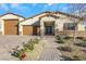 Single-story home with two-car garage and landscaped front yard at 6364 Cambridge Creek Ct, Las Vegas, NV 89149