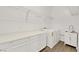 Laundry room with white cabinets and ample counter space at 6364 Cambridge Creek Ct, Las Vegas, NV 89149