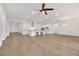 Open-concept living space with hardwood floors and a kitchen island at 6364 Cambridge Creek Ct, Las Vegas, NV 89149